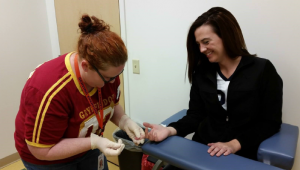 Nurse educator Brittany Hanchett gets tested to show how easy it is on World AIDS Day.